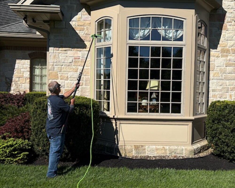 Lion Window Cleaning at work on a State College home